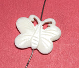 Carved bone bead double sided butterfly