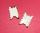 Carved bone bead drilled through butterfly