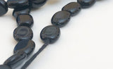 Onyx Flat Oval Black 8mm-15 inch strand