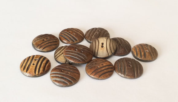 12 Burnt horn buttons round carved 1